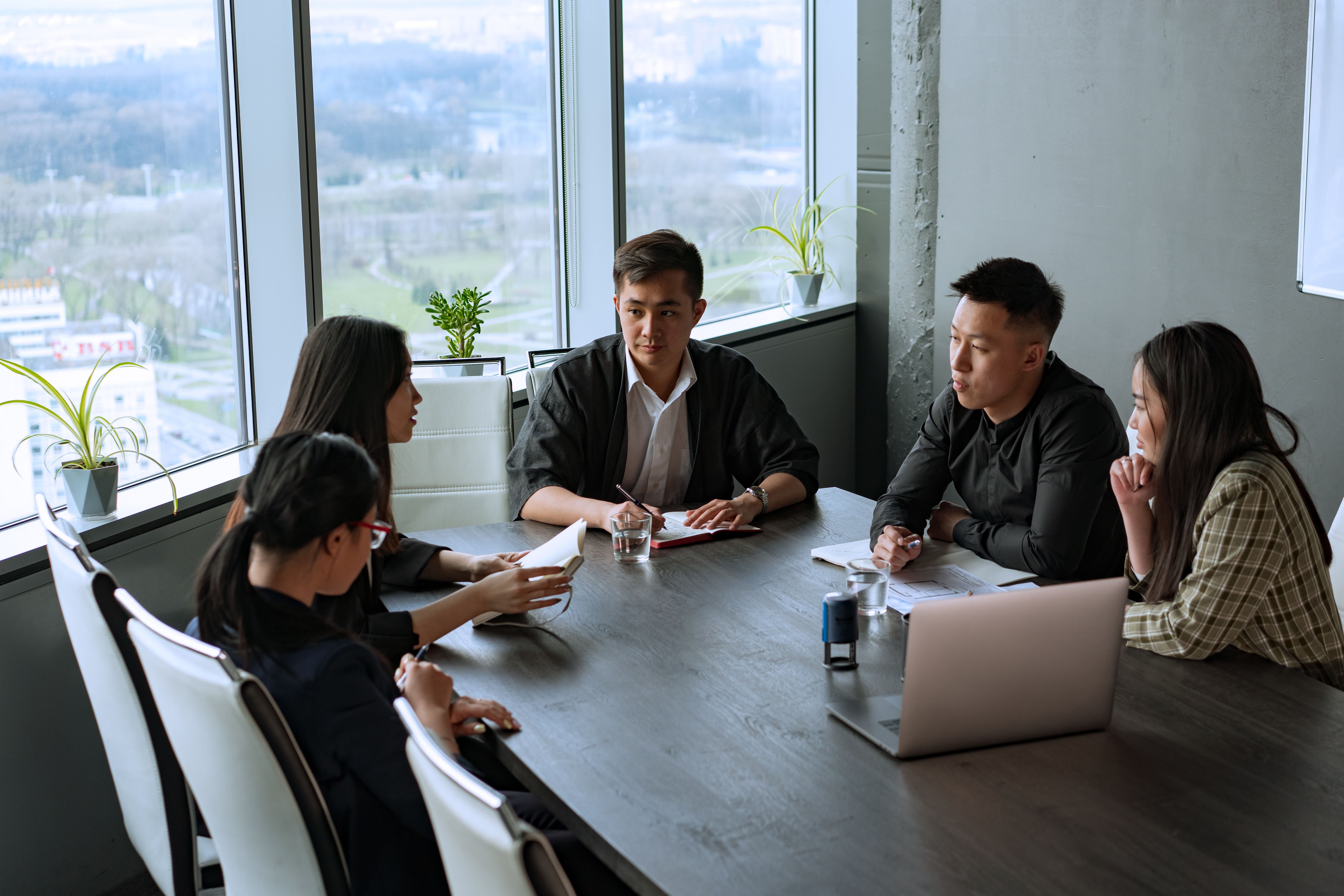 Asian brand-development team in a focused strategy working session